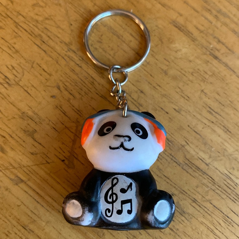Star Awards Panda with headphones Keychain in good condition